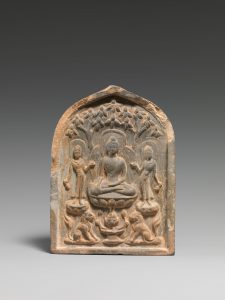 A stone plaque, arched on top