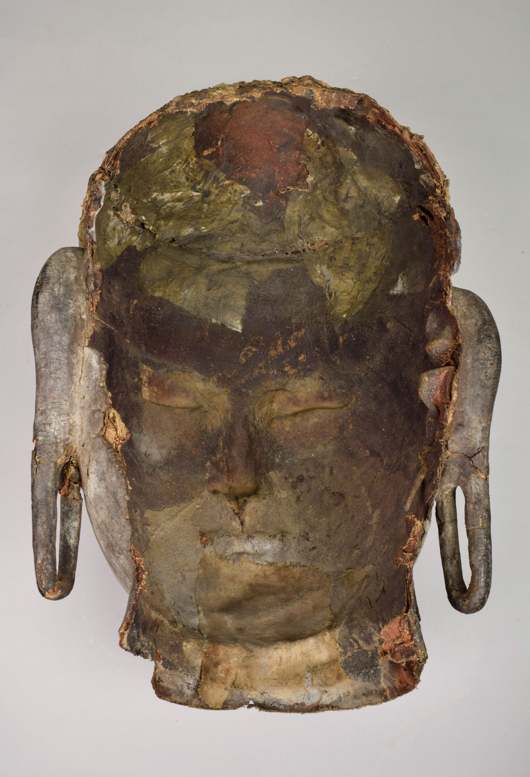 showing the interior of a bodhisattva sculpture's head