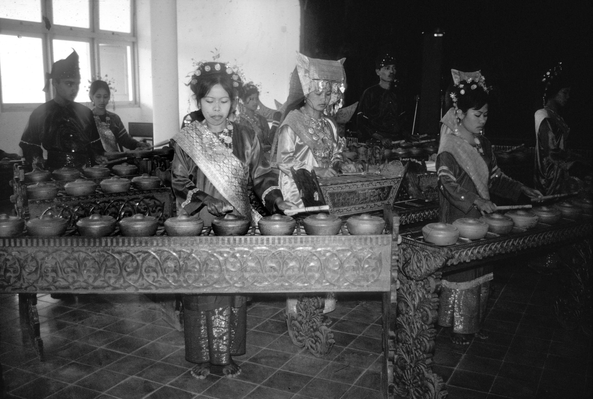 Black and white photo of a a talempong orchestra.
