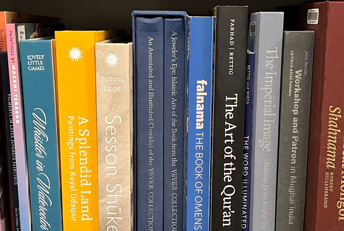 a row of books on a bookshelf