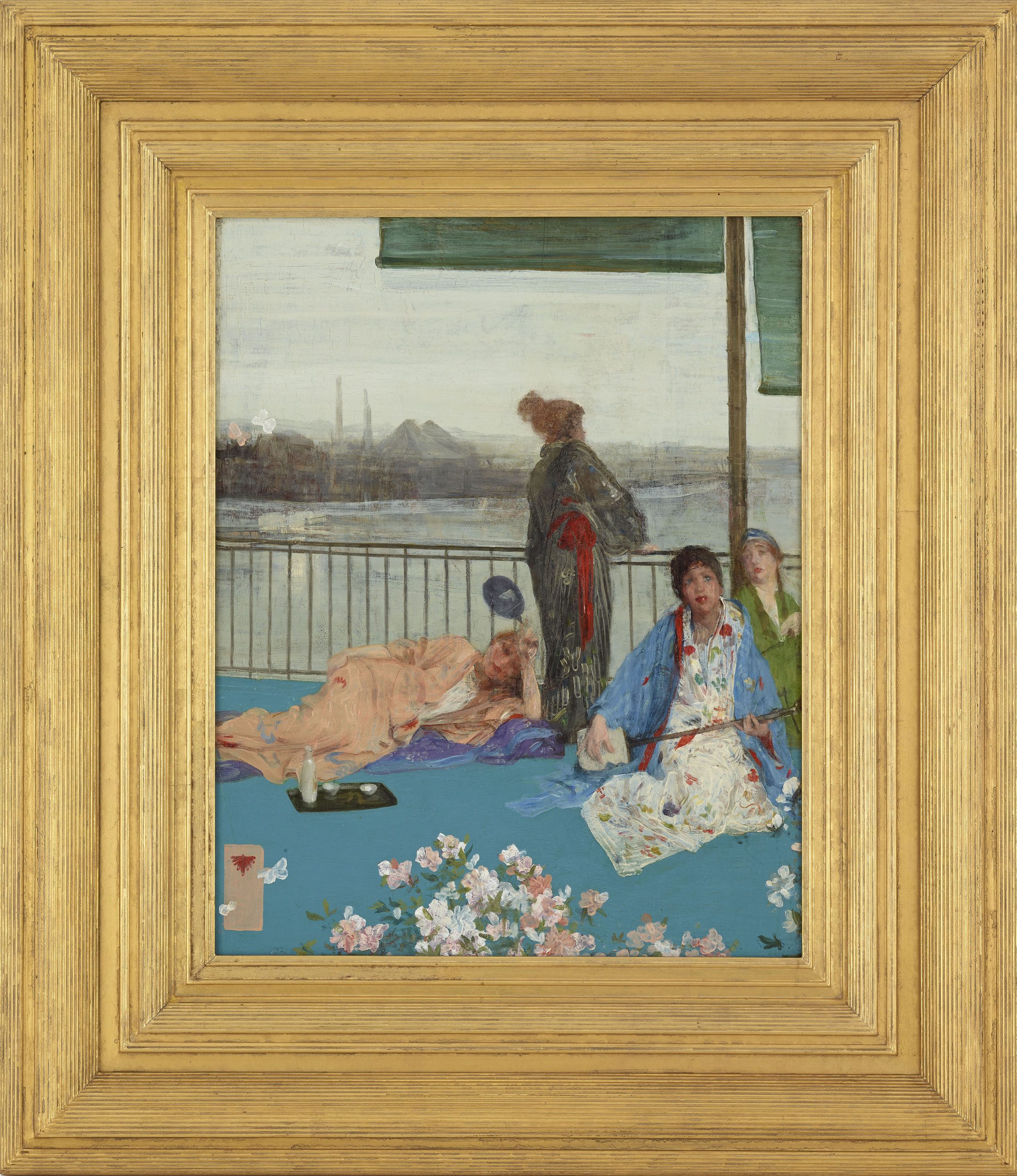 English models dressed in kimonos posing on a balcony with factories in the background