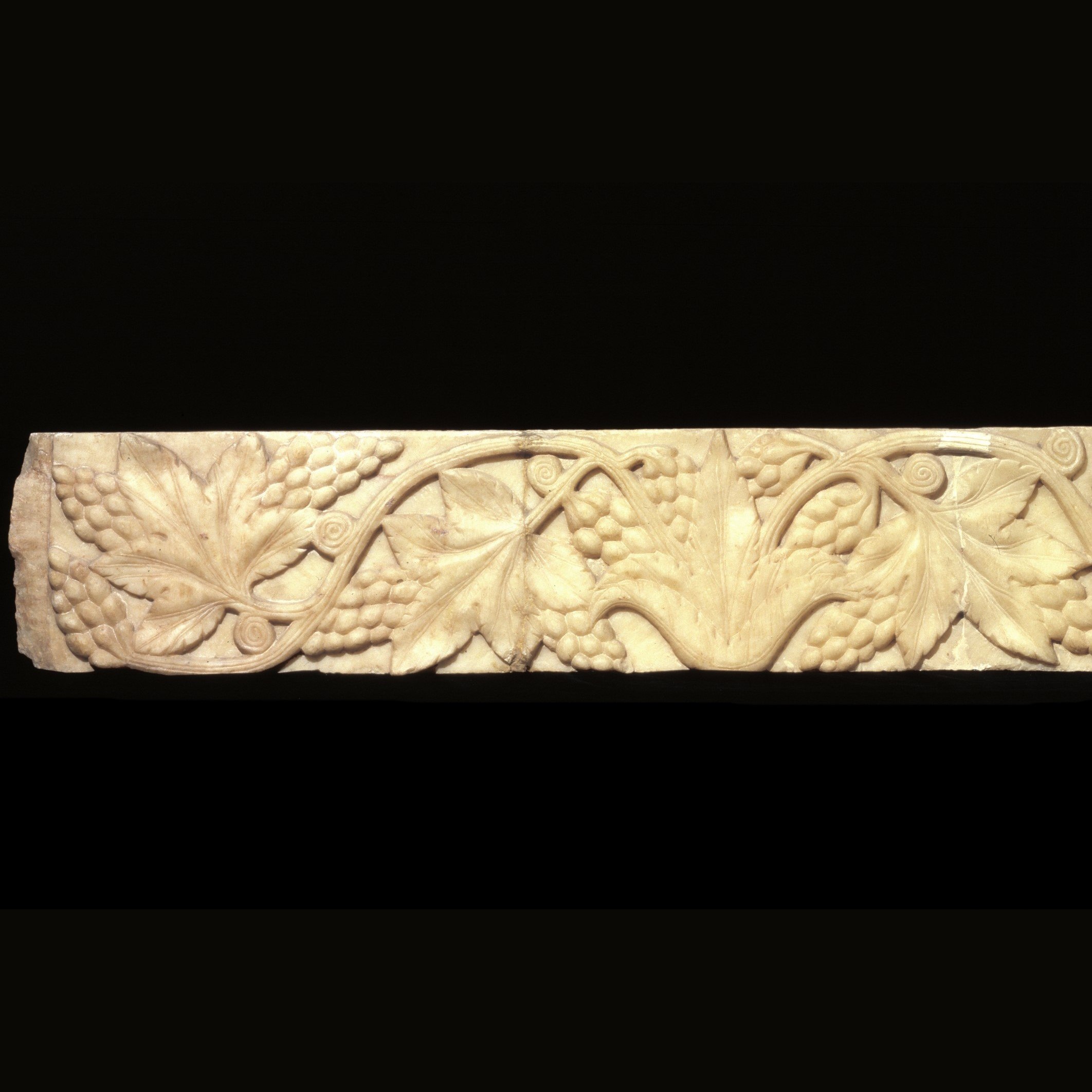 Alabaster cornice with vine scroll