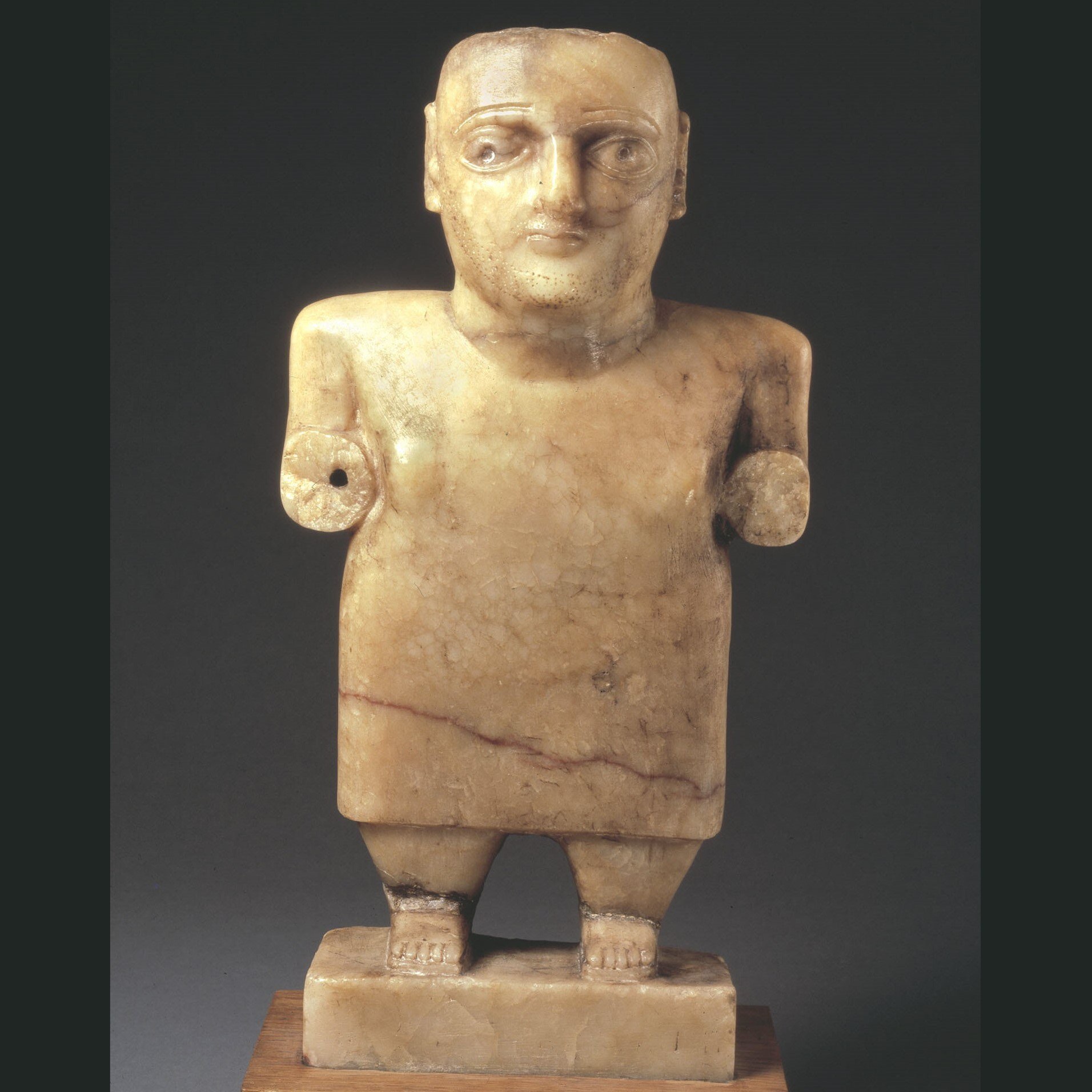 Alabaster statue of a standing male figure