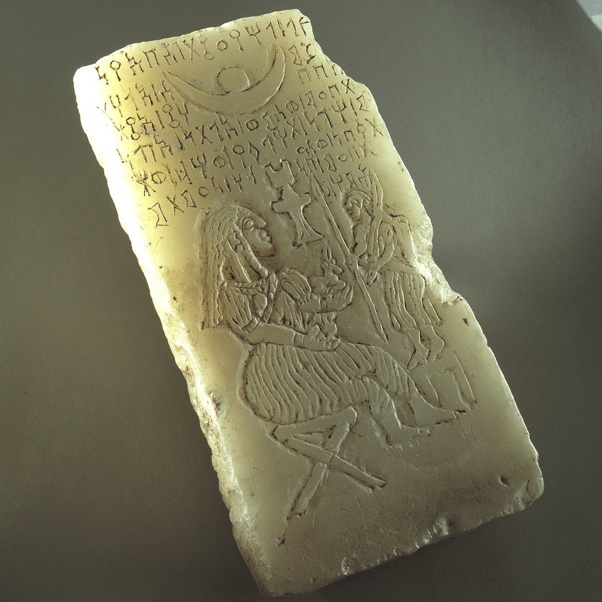 Alabaster stela depicting an offering to the sun goddess Shams