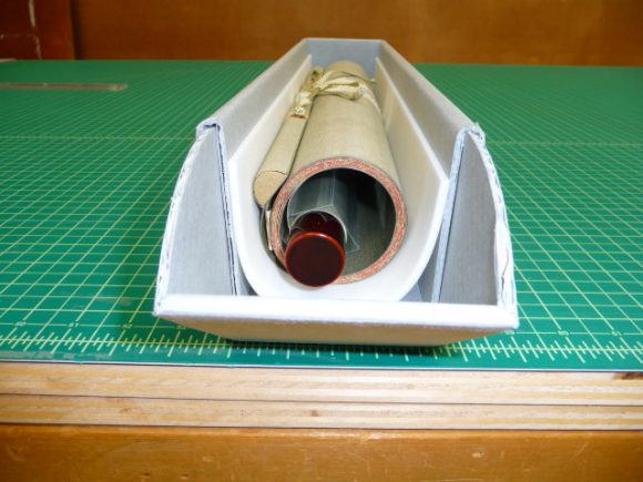 roll of paper on green gridded cutting mat