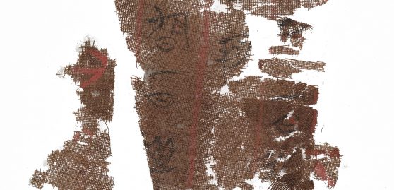 Brown silk manuscript fragments with ancient Chinese writing on them
