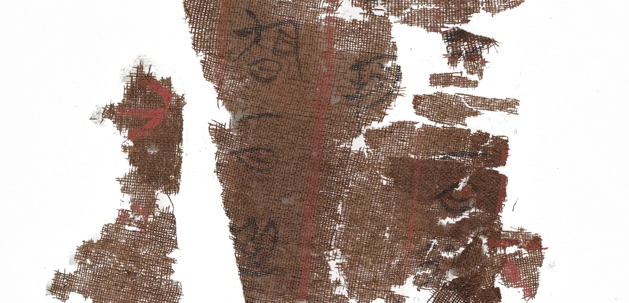 Brown silk manuscript fragments with ancient Chinese writing on them